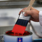 Sherwin Williams Paint Can with Red Paint on Purty Brush